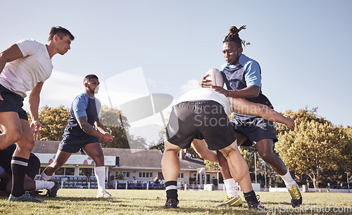 Image of Sports, rugby and men tackle on field for match, practice and game in tournament or competition. Fitness, teamwork and players playing on grass for exercise, training and performance to win ball