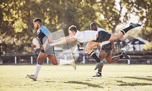 Image of Sports, rugby and men in action on field for match, practice and game in tournament or competition. Fitness, teamwork and strong players tackle for exercise, training and performance to win ball