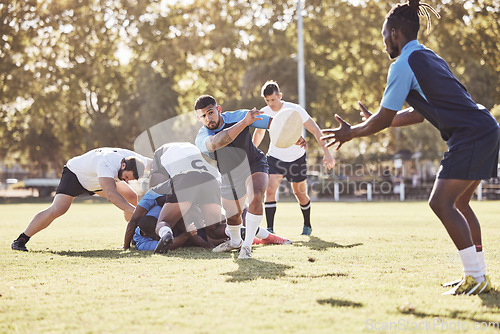 Image of Sports, rugby and men pass ball on field for match, practice and game in tournament or competition. Fitness, teamwork and group of players playing for exercise, training and performance for winning