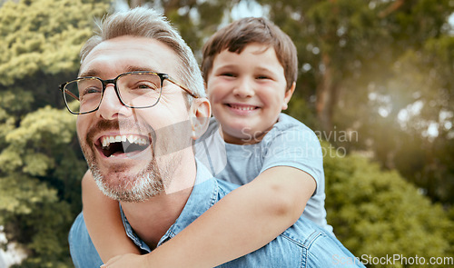 Image of Family fun, piggyback and father with child in a park happy, playing and laughing in nature. Hug, love and parent carrying son in a garden, laugh and enjoying games, smile and together on the weekend