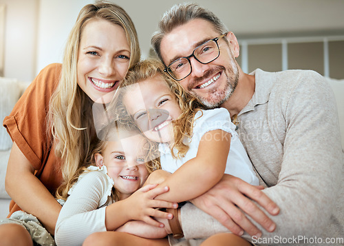 Image of Parents, portrait and sofa with hug, kids and smile with love, bonding and care in family home together. Father, mother and daughters with happiness, embrace and relax on lounge couch in house
