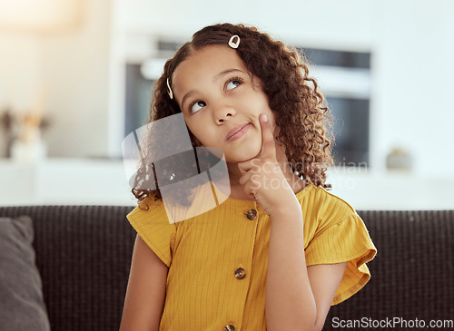 Image of Thinking, young girl and home with ideas and inspiration on a living room sofa. Cute, decision and child with an idea and option consideration on a lounge couch in a house with youth and weekend plan