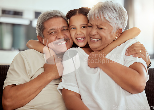 Image of Home, grandparents hug portrait and family with child and happiness on a living room couch. Fun, smile and happy bonding with childcare, love and kid together with a young girl on a house sofa