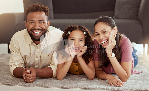 Image of Family home, portrait and youth with mom, dad and young girl together with fun. Living room, mother and father with a child by sofa with love, bonding and parent support with a smile in lounge