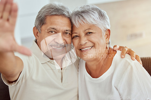 Image of Senior couple, smile and sofa for selfie with happiness, hand and photography for blog, post or portrait in home. Elderly man, old woman and happy with smile, social media app and profile picture