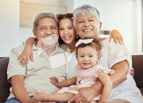 Image of Portrait, grandparents hug and family with children and happiness on a living room . Fun, baby smile and bonding with childcare, love and kids together with a young girl and newborn on a home sofa