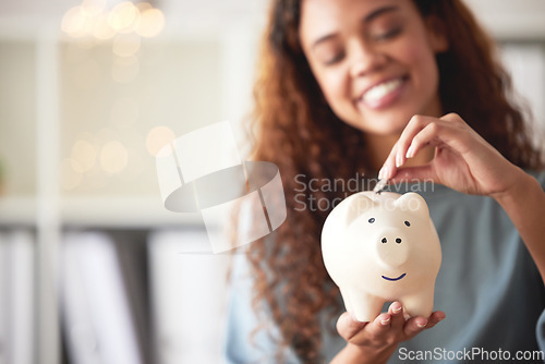 Image of Finance, savings and closeup of a piggy bank with money for future investment, budget or wealth. Cash, accounting and woman investing coins in a funds jar for profit growth or financial freedom.