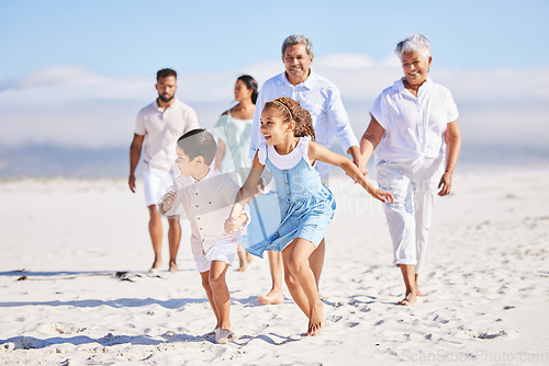 Image of Holiday, happy and big family running on the beach for playing and bonding on a weekend trip. Travel, excited and children having fun with their grandparents and parents by the ocean on a vacation.