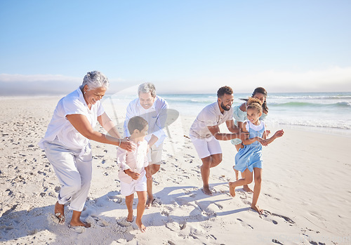 Image of Travel, holiday and big family playing on beach for running and bonding on weekend trip. Happy, excited and children having fun with their grandparents and parents by the ocean on tropical vacation.