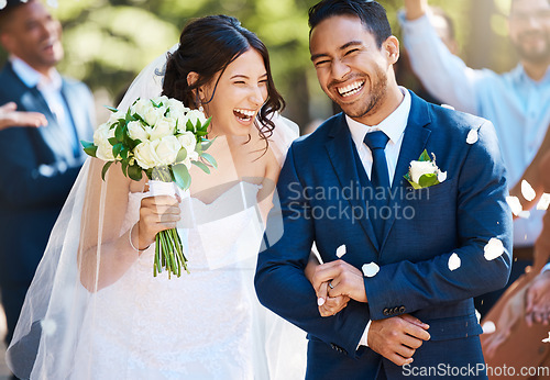 Image of Love, laughing and couple walking at their wedding with guests in celebration of romance. Happy, smile and young bride with bouquet and groom with crowd celebrating at the outdoor marriage ceremony.