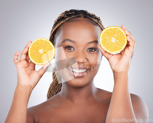 Image of Beauty, orange and portrait of black woman in studio for natural, cosmetics and vitamin c. Nutrition, diet and detox with face of female model on grey background for citrus fruit and health product