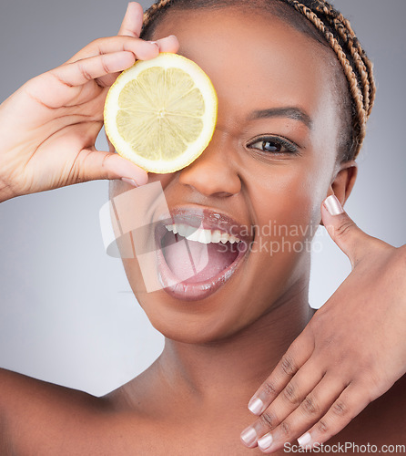 Image of Beauty, lemon and portrait with black woman in studio for natural, cosmetics and vitamin c. Nutrition, diet and detox with face of female model on grey background for citrus fruit and health product