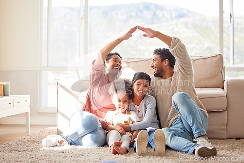 Image of Parents, floor and roof hands with kids, happiness and sign for safety, security or family home with bond in lounge. Father, mother and daughters for care, love or together with icon, emoji and smile