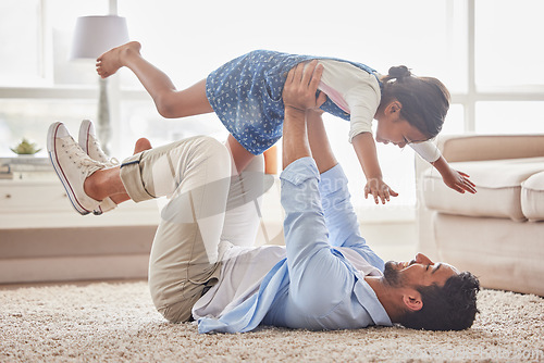 Image of Game, airplane and father with girl on a floor with love, fun and playing in their home together. Happy, flying and child with parent in living room for bonding, relax and enjoying weekend in lounge