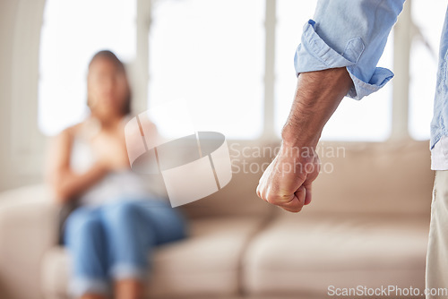 Image of Angry, hand of man and domestic violence with scared family in living room, marriage problem and fear. Toxic relationship conflict, abuse and anger, fist of male and danger for woman and kid on sofa.