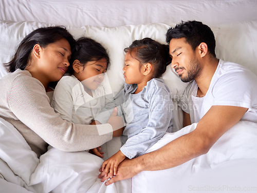 Image of Relax, love and family sleeping in a bed from above, peaceful and dreaming in their home. Sleep, peace and top view of children with parents in a bedroom, tired and resting together on the weekend