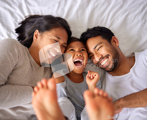 Image of Bed, fun and happy family playing, wake up and happy from above, tickle and laughing in their home. Bedroom, games and girl with parents, smile and laugh, relax and love in their house on the weekend