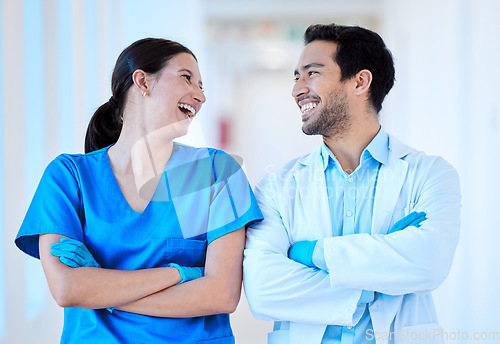 Image of Dentist, nurse laugh and arms crossed with assistant and funny joke at dental office and clinic. Comedy, woman worker and healthcare professional with happiness and laughing in workplace with smile