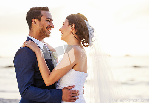 Image of Wedding day, beach and couple hug at ocean for love, union and celebration on nature background. Summer, marriage and happy groom with bride embracing at sea ceremony, smile and romantic in Hawaii