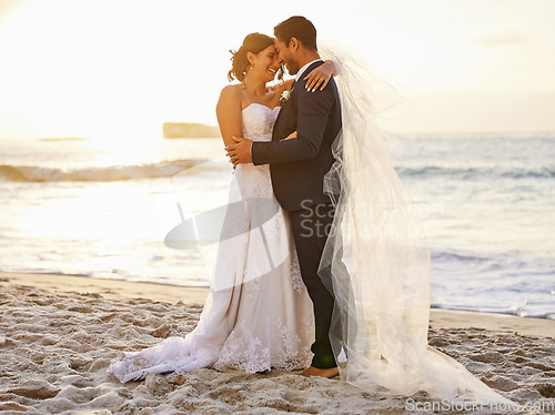 Image of Beach, wedding and couple hug at ocean for love, union and celebration against a nature background. Summer, marriage and happy groom with bride embracing at sea ceremony, smile and romantic in Bali