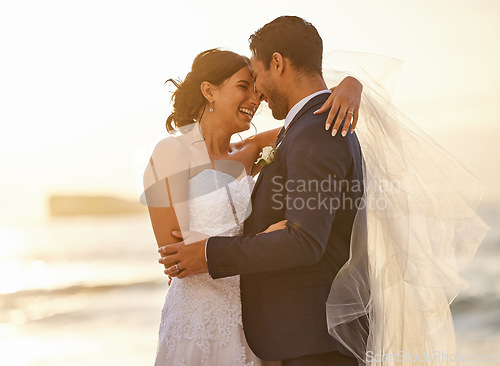 Image of Wedding, beach and couple hug at sunset for love, union and celebration against a nature background. Summer, marriage and happy groom with bride embracing at sea ceremony, smile and romantic in Miami