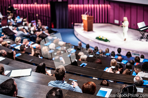 Image of Woman giving presentation on business conference event.