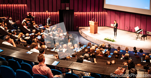 Image of Woman giving presentation on business conference event.