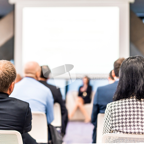 Image of Woman giving presentation on business conference event.