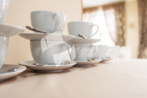 Image of Many cups on table,