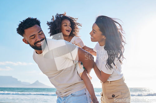 Image of Happy family, travel and parents with a child at the beach excited for a sea or ocean vacation together in happiness. Young, mother and father playing piggyback with a kid on a holiday in summer