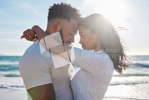 Image of Couple hug at beach, love and travel with sun and sea, affection and care with vacation in Mexico. Commitment, support and trust with relationship, tourism and tropical with people in embrace outdoor