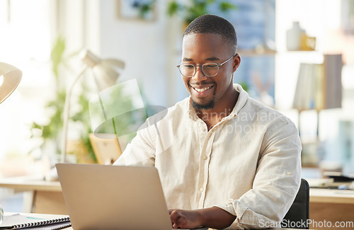 Image of Black business man, startup and typing with laptop, smile and happy with web design, planning or development. African developer, businessman or entrepreneur with computer for coding in modern office