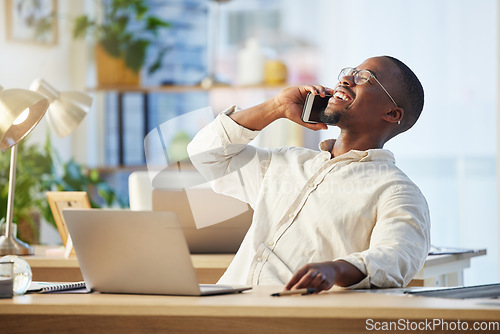 Image of Happy African business man, phone call and laugh with contact, comic conversation and talking at desk. Young black businessman, communication expert or crm with smartphone, happiness and connectivity
