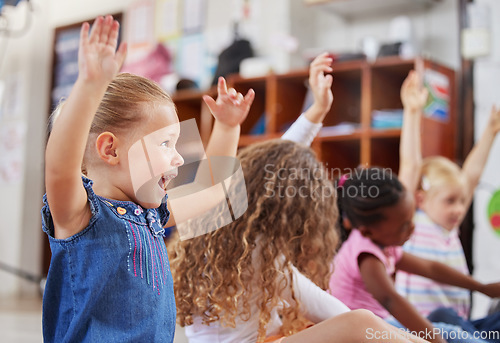 Image of School, raise hands and children in a classroom for education or knowledge at daycare. Kindergarten, happy and young kid students with a question gesture for learning in a lesson together at nursery.