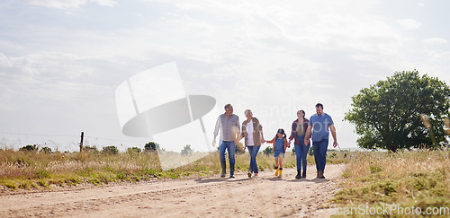 Image of Love, happy family walking holding hands and on a farm with blue sky. Support or care, happiness or agriculture and people walk outdoors by countryside or rural environment together with generation