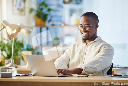 Image of Laptop, business and black man typing, writer and working on web project in office workplace. Smile, computer and African male professional, copywriter and writing email, report or research proposal.