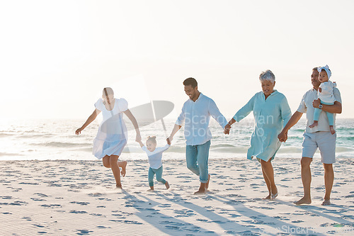 Image of Big family, holding hands and walking on beach for holiday weekend or vacation with mockup space. Grandparents, parents and kids on a ocean walk together for fun bonding or quality time in nature