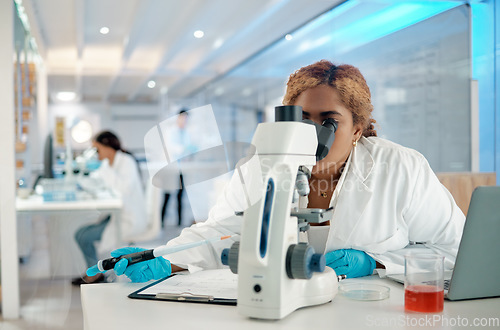 Image of Science, medical and microscope with a woman at work in a laboratory for research or innovation. Healthcare, investigation and development with a female scientist working in a lab for pharmaceuticals