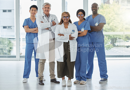Image of Leadership portrait, doctors and nurses with arms crossed standing together in hospital. Face, teamwork and confident medical professionals, group or happy surgeons with collaboration for healthcare
