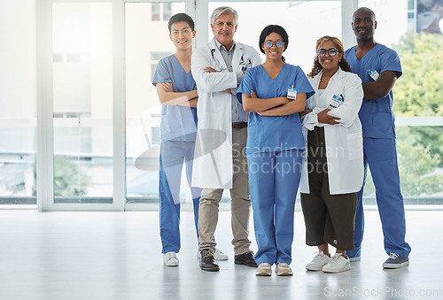 Image of Portrait, doctors and team of nurses with arms crossed standing together in hospital. Face, confident and medical professionals, surgeons or group with healthcare collaboration, teamwork and happy.