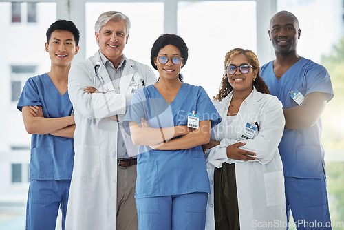 Image of Nurses, portrait and team of doctors with arms crossed standing together in hospital. Face, confident and medical professionals, surgeons or group with healthcare collaboration, teamwork and happy.