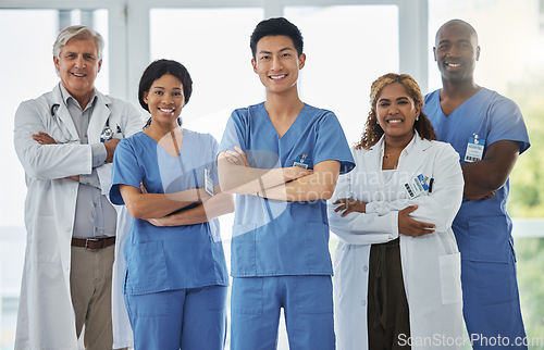 Image of Nurses, portrait and team of doctors with arms crossed standing together in hospital. Face, confident and medical professionals, group and happy surgeons in collaboration, teamwork and healthcare.