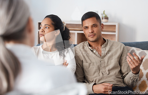 Image of Angry couple on sofa, therapy and marriage counselling, advice and problem solving in relationship. Stress, man and woman with therapist in conversation, work on healthy communication and healing.