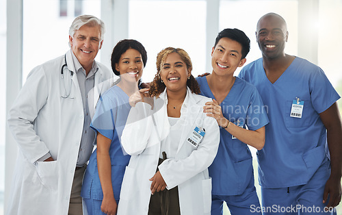 Image of Portrait, nurses and team of doctors smile standing together in hospital or clinic. Face, healthcare and medical professionals, group diversity or happy surgeons in collaboration, teamwork or support