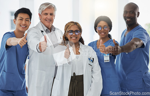 Image of Thumbs up portrait, doctors and team of nurses together in happy hospital. Face, like hand and medical professionals, surgeons or group emoji for success, collaboration and support for healthcare.