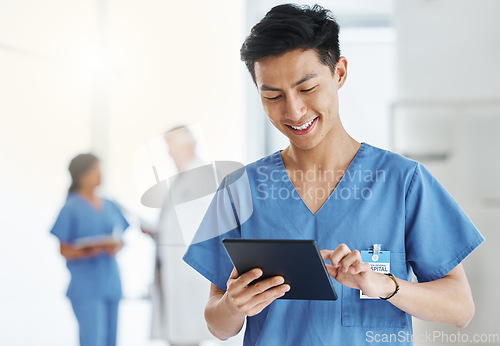 Image of Asian man, smile and nurse with tablet for research, telehealth or healthcare in hospital. Technology, medical professional and male doctor with touchscreen, wellness app and online consultation.