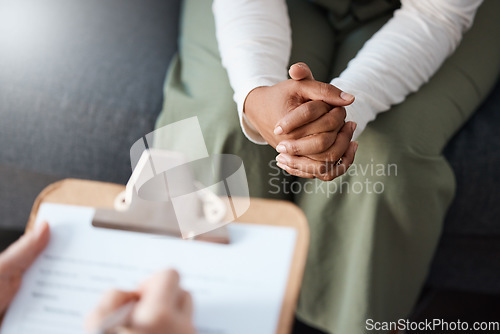 Image of Woman, hands and therapist writing on clipboard in consultation for mental health, psychology or healthcare. Hand of female person or psychologist consulting patient with anxiety or stress in therapy