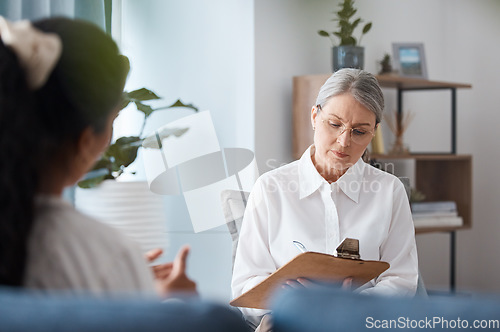 Image of Woman, therapist and writing on clipboard in consultation for mental health, psychology or healthcare. Female person or psychologist taking notes and consulting patient, anxiety or stress in therapy