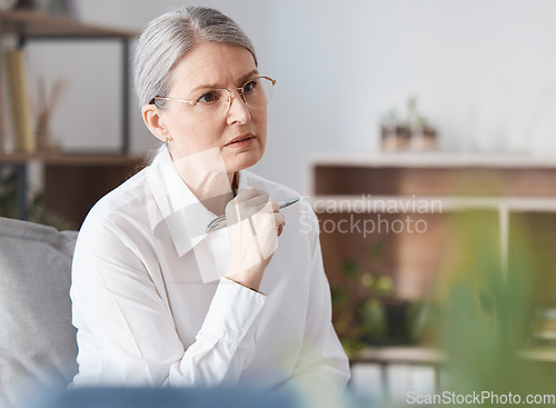 Image of Serious woman, therapist and listening in therapy session, mental health or psychology healthcare counseling. Female person or psychologist in concern for patient, anxiety or stress in consultation
