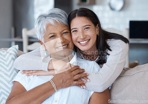 Image of Hug, mothers day and portrait of women smile for care, trust and support on a sofa or couch in a home together. Happiness, love and elderly mother and daughter relax in a living room or lounge